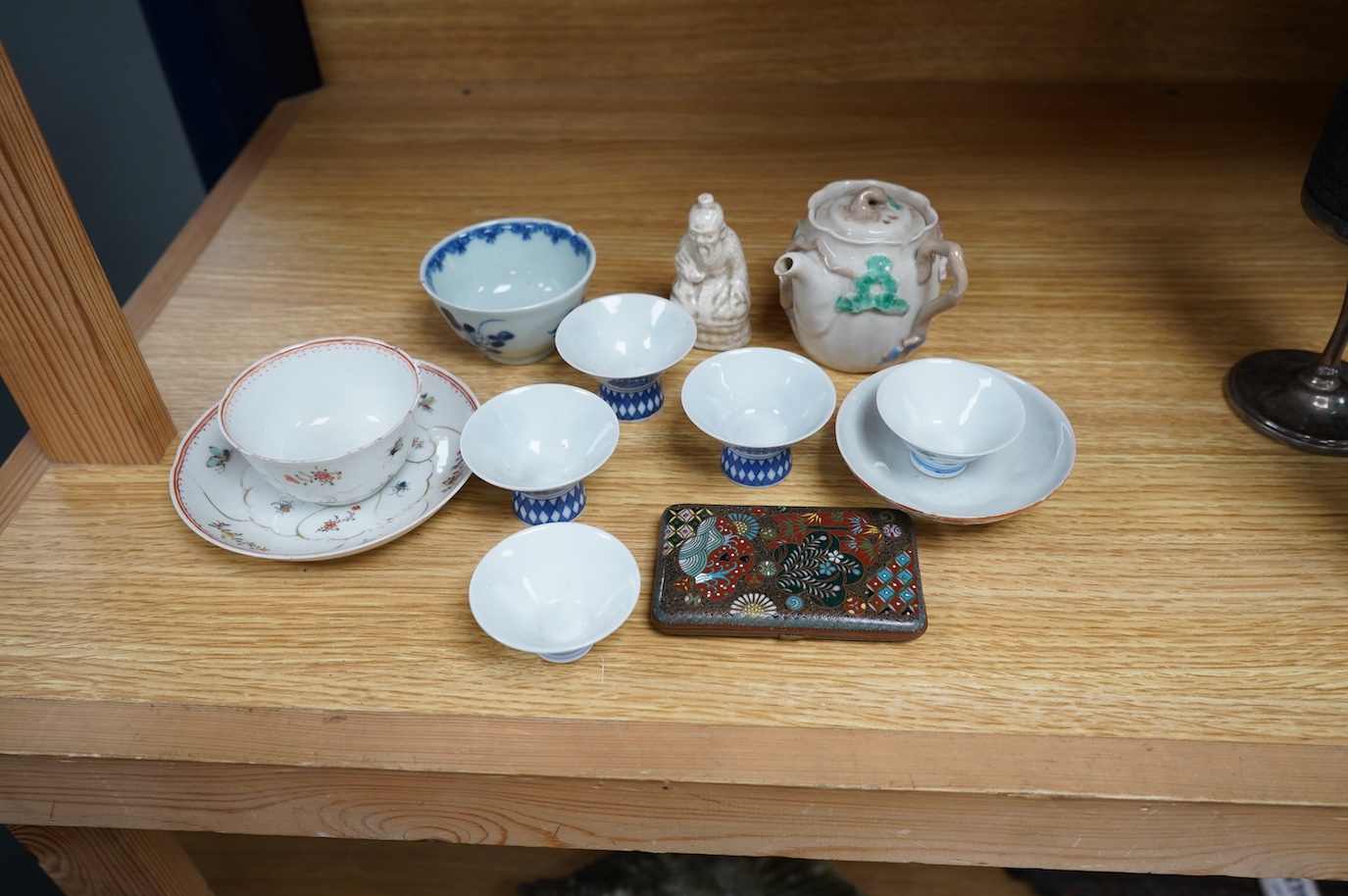 A small group of Chinese and Japanese ceramics to include an 18th century Chinese export teabowl and saucer and a cloisonne cigarette box. Tallest 7cm. Condition - fair to good